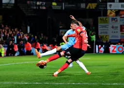 Alfie Doughty wraps his foot around the ball