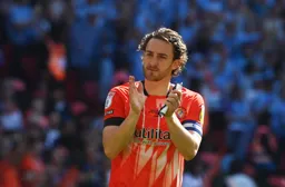 Tom Lockyer thanks the Hatters fans before the start of the game