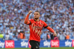 Carlton Morris celebrates after scoring his penalty