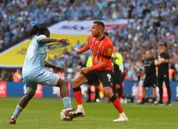 Carlton Morris look to lay the ball off