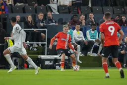 Alfie Doughty passes to Carlton Morris