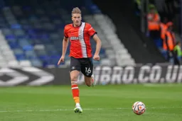 Reece Burke chasing the ball