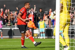 Carlton Morris celebrates with the fans