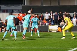 Carlton Morris launches a header at goal