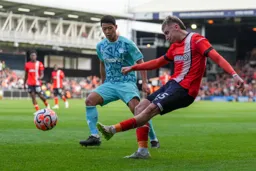 Alfie Doughty crosses at the Oak Road End