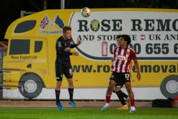 Luke Berry heads clear of the defence and the removal lorry