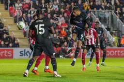 Carlton Morris heading for goal without success
