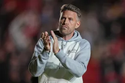 Rob Edwards applauds the Town faithful after a disappointing night