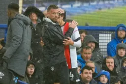 Tom Lockyer being consoled by the Boss after coming off injured