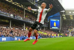 Carlton Morris celebrates in from of the Everton fans