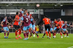 Carlton Morris gets his header on target
