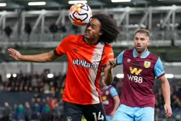 Tahith Chong tries to direct the ball with his eyes closed