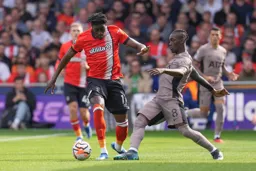 Elijah Adebayo glides past the tackle