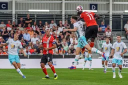 Elijah Adebayo gets above Dara O`Shea to win a header