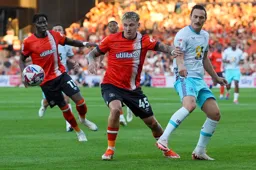 Alfie Doughty watches the ball go through