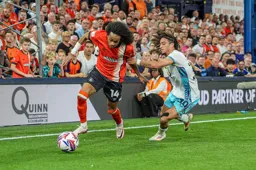 Tahith Chong leaves Luca Koleosho in his wake
