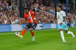 Chiedozie Ogbene controls the ball with the outside of his foot