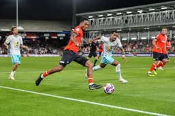 Reuell Walters make a break into the Burnley Penalty area