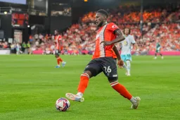 Shandon Baptiste looks to play a through ball