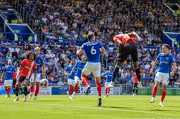 Elijah Adebayo gets in a downward header