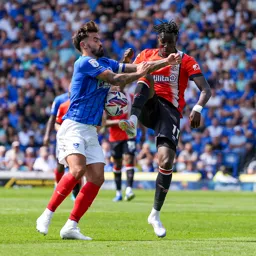 Elijah Adebayo goes in with a high foot