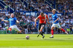 Carlton Morris gets in between defenders