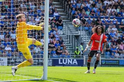 Tahith Chong looks on as Will Norris keeps the ball out