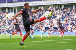 Carlton Morris gets a toe end to the ball