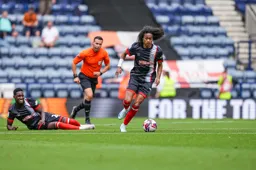 Tahith Chong charges forward with the ball