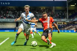 Carlton Morris grabs a handful of shirt