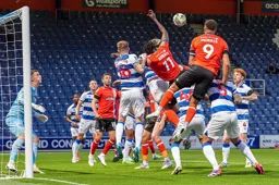 Carlton Morris wins a header at the back post