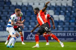 The ball just eludes Elijah Adebayo