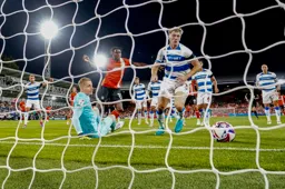 It is an own goal for the Town as Elijah Adebayo watches the ball cross the line