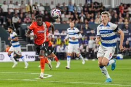 Elijah Adebayo and Jimmy Dunne have their eyes fixed on the ball