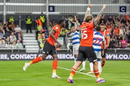 Elijah Adebayo and Alfie Doughty look happy following the Town`s only goal of the game