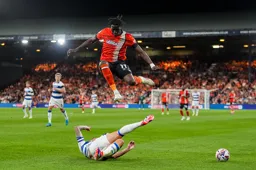 Elijah Adebayo leaps high to avoid a fallen Ranger