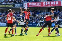 Tahith Chong looks to head the ball in the direction of Jordan Clark