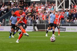 Carlton Morris scores the Town`s first goal from the penalty spot
