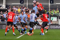 Reece Burke rises highest to win an attacking header