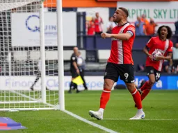 Carlton Morris celebrates after scoring the first goal