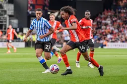Tahith Chong moves forward as Yan Valery closes in