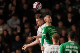 Reece Burke challenges for a high ball