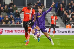 Elijah Adebayo loses the ball in this tussle