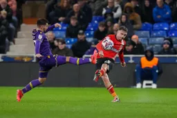 Alfie Doughty plays the ball downfield