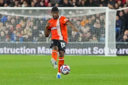 Teden Mengi looks to his left