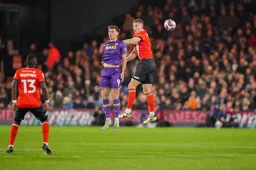 Mark McGuinness in an aerial duel against Mark Harris