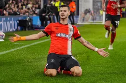 Tom Krauss celebrates with a knee slide