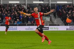 Tom Krauss looks happy. He has just scored the Town`s second goal