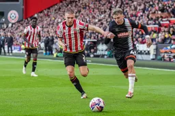 Alfie Doughty in a race to the ball against Alfie Gilchrist
