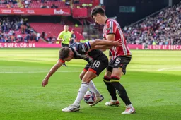 Jordan Clark ducks down as he looks for the ball